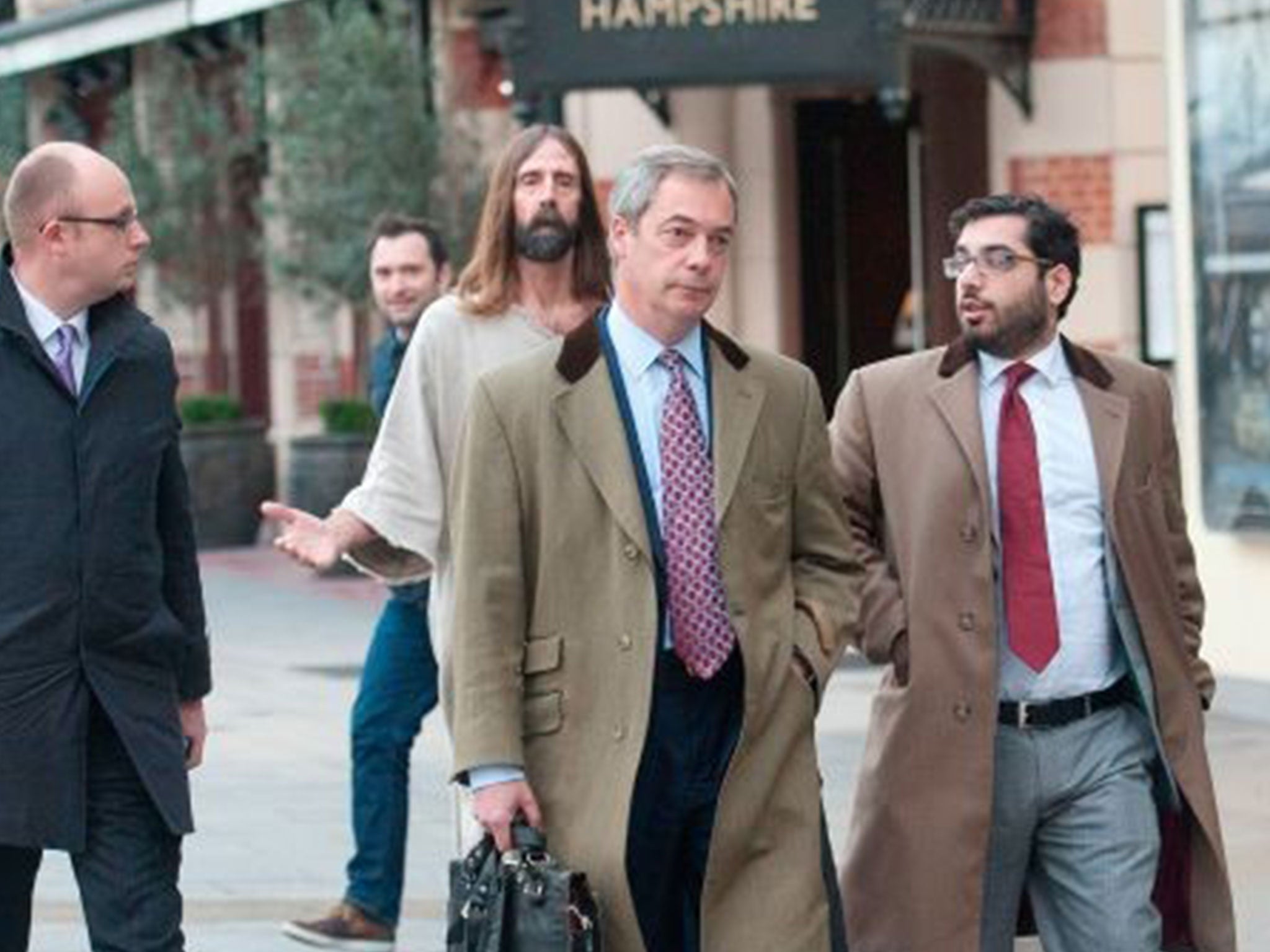 Kevin Lee Light, aka Jesus of Hollywood, pursues Nigel Farage as he leaves the LBC studios