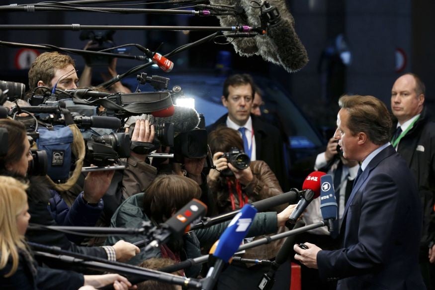 David Cameron faces the press as he arrives in Brussels for the EU leaders summit on Thursday