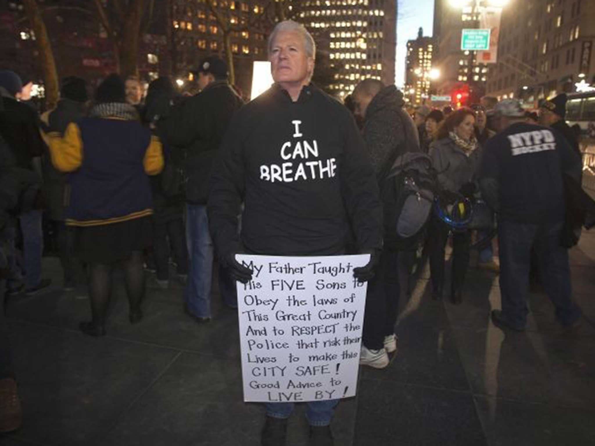 A pro-police supporter stands in his t-shirt at the demonstration in New York City