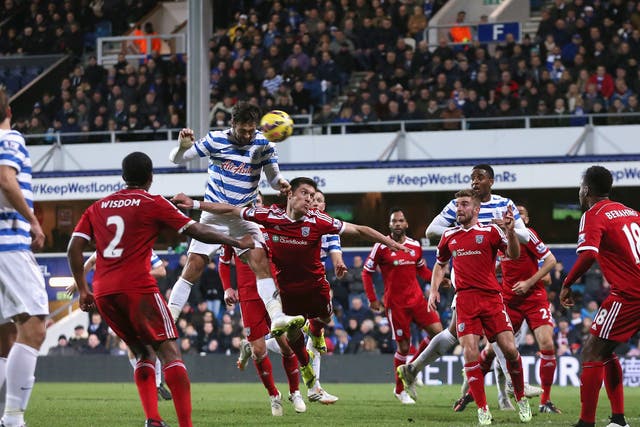 Charlie Austin heads in his third goal to win the game for QPR