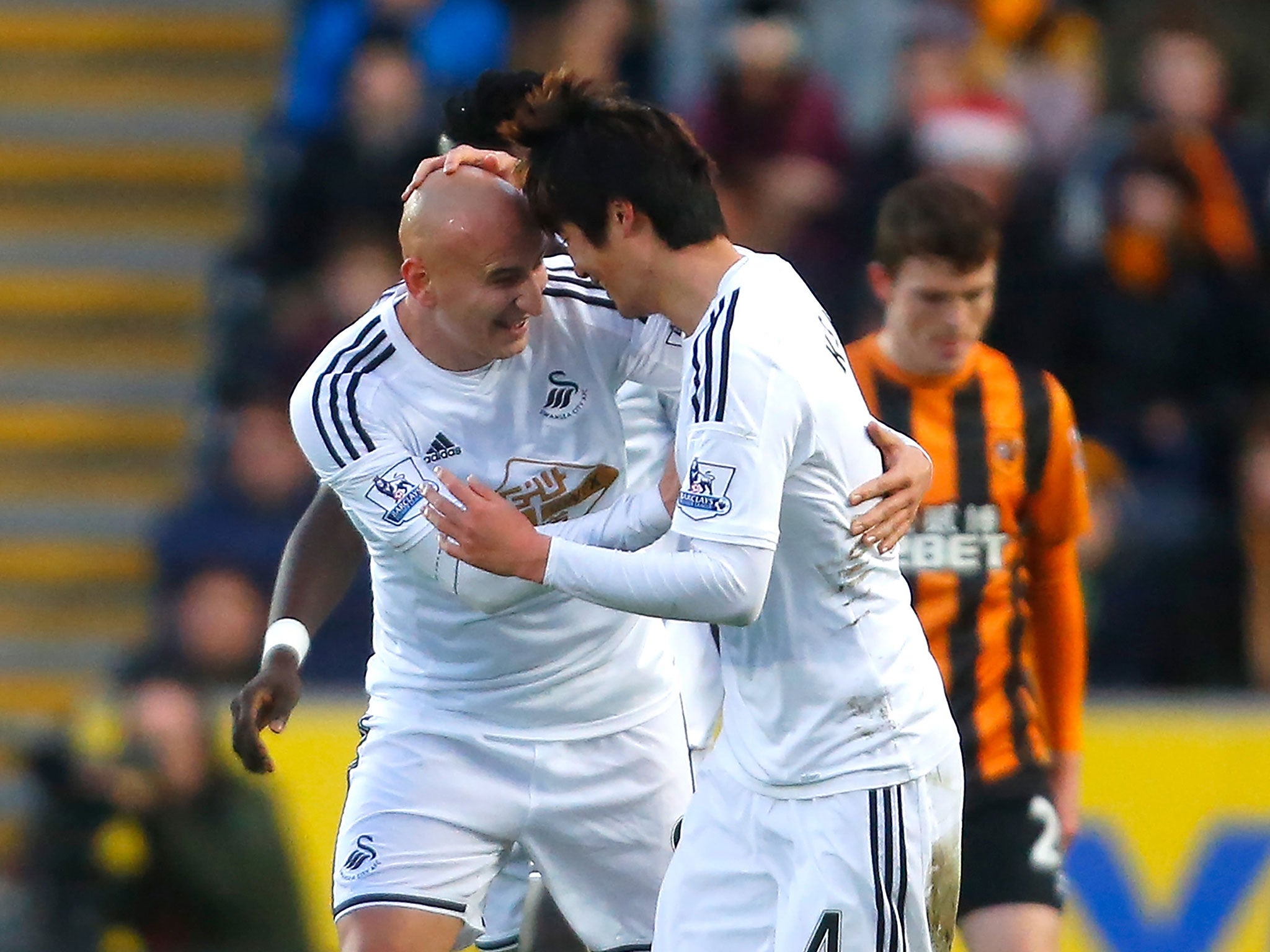Jonjo Shelvey and Ki Sung-yeung celebrate putting Swansea ahead against Hull