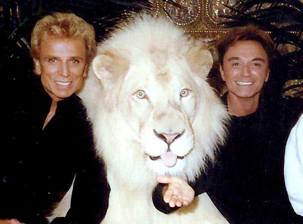 Siegfried and Roy with one of their white lions in 2000