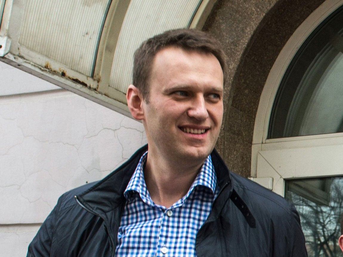 Russian opposition leader Alexei Navalny leaves a court building after a hearing in his Yves Rocher's case in Moscow, on March 7, 2014