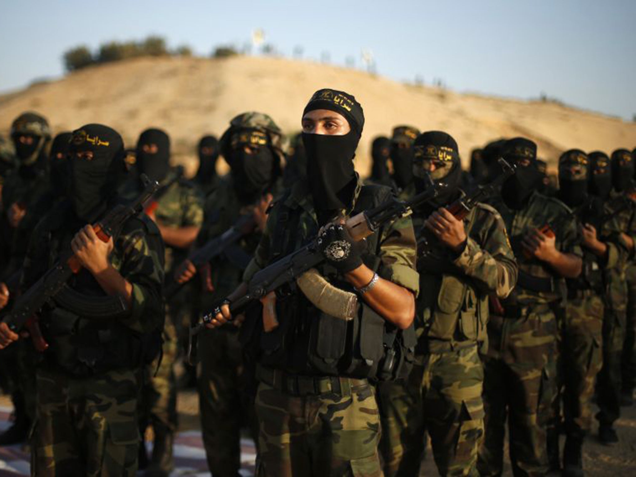 Palestinian Islamic Jihad militants march during a military drill in the southern Gaza Strip