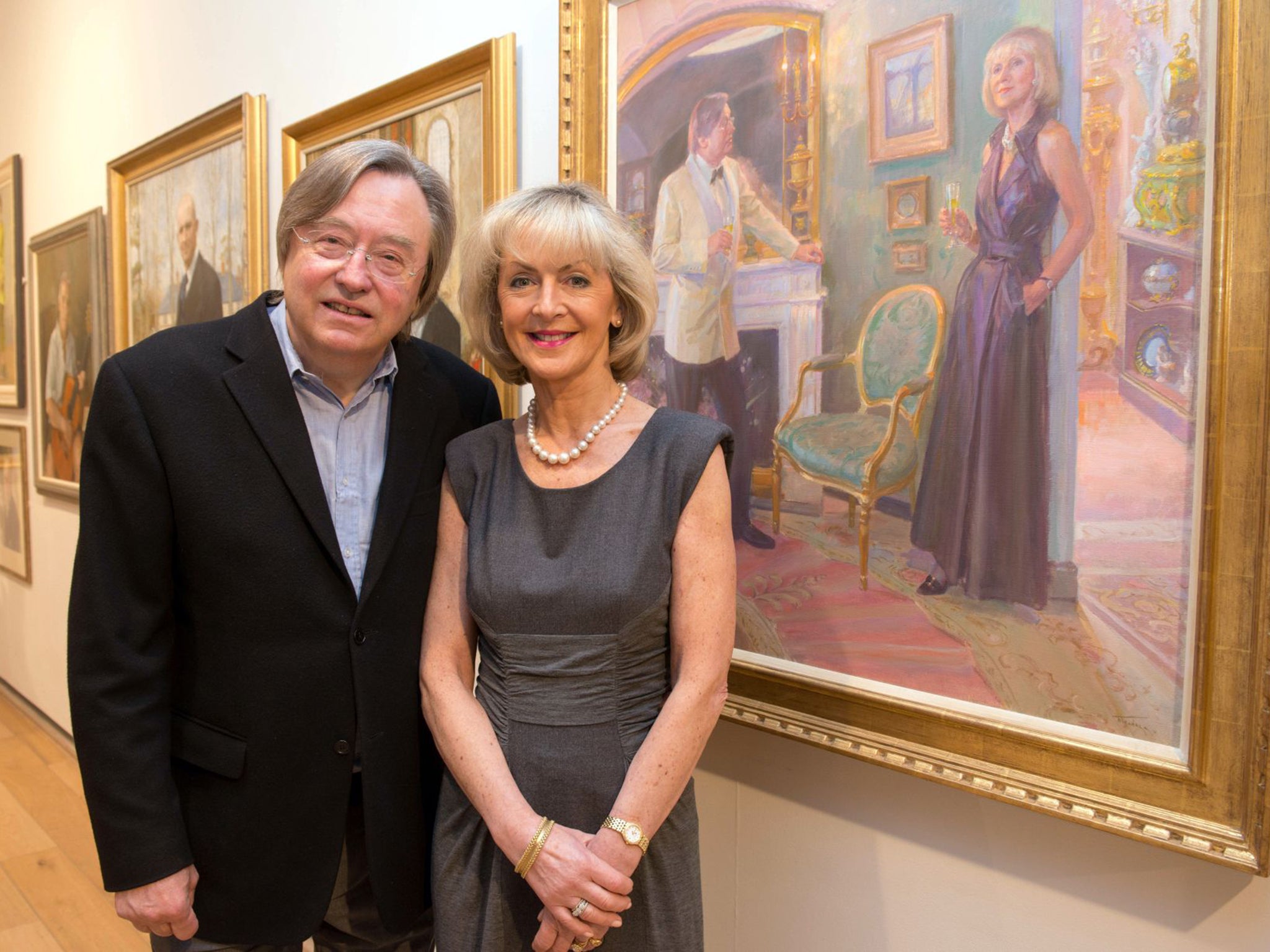David Mellor and Lady Cobham with their portrait by June Mendoza at the Mall Galleries, London, in 2012