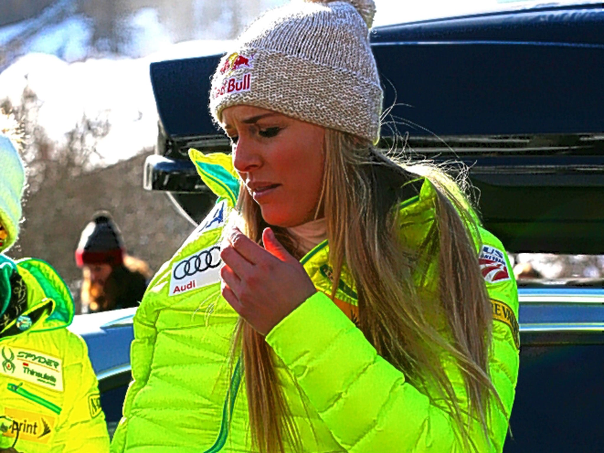 A disappointed Lindsey Vonn, with her right arm strapped up, leaves the course at Val d’Isère after crashing in the Super-G