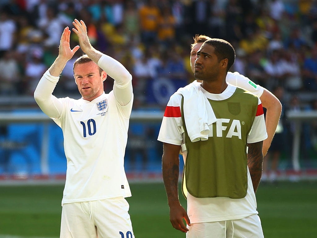 Wayne Rooney applauds the England fans after their elimination at the World Cup