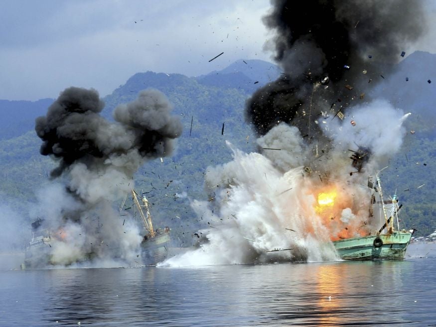Two foreign flagged fishing boats registered in Papua New Guinea are destroyed by the Indonesian Navy after they were seized earlier for supposedly illegal fishing off the coast of Ambon, Maluku