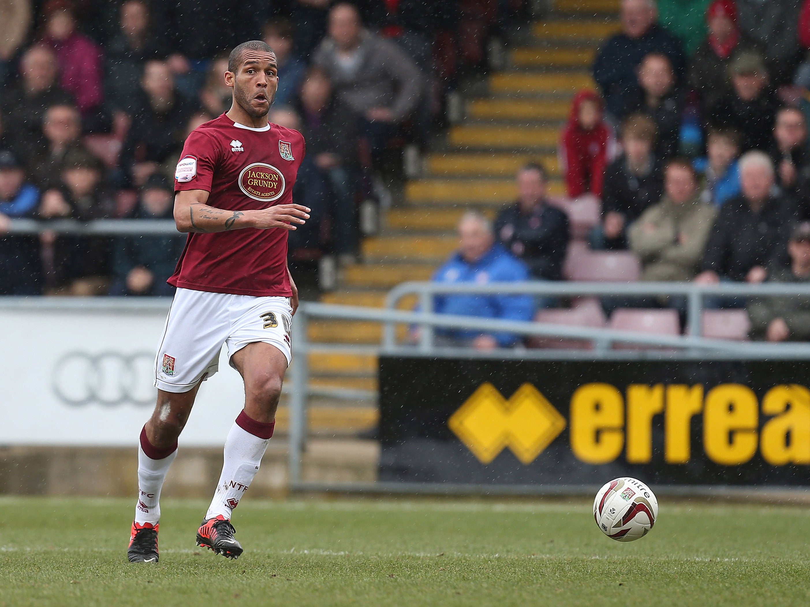 Clarke Carlisle playing for Northampton Town in 2013