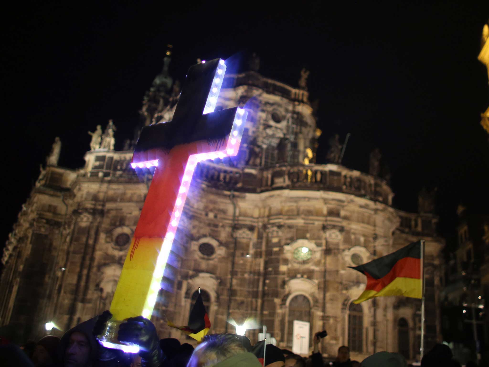 A cross at the Pegida protest in Dresden