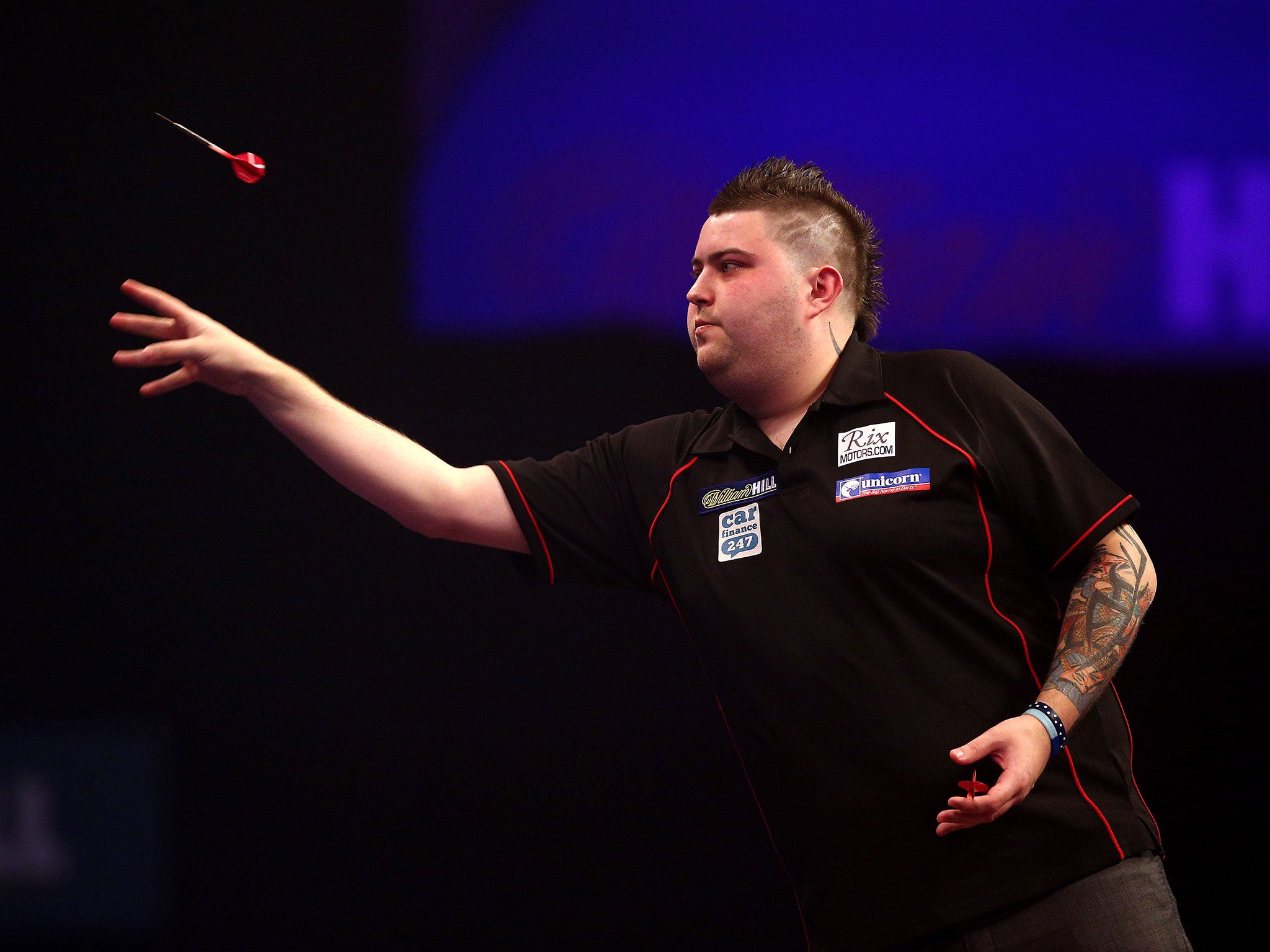 Michael Smith battled back from a set down to see off Mensur Suljovic