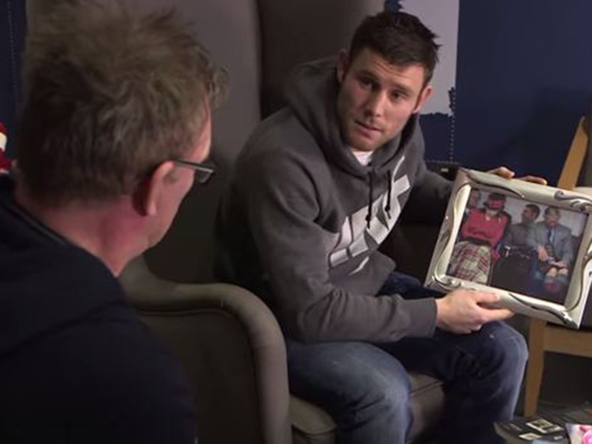 Milner shows off his picture of a visit to the Royal Family