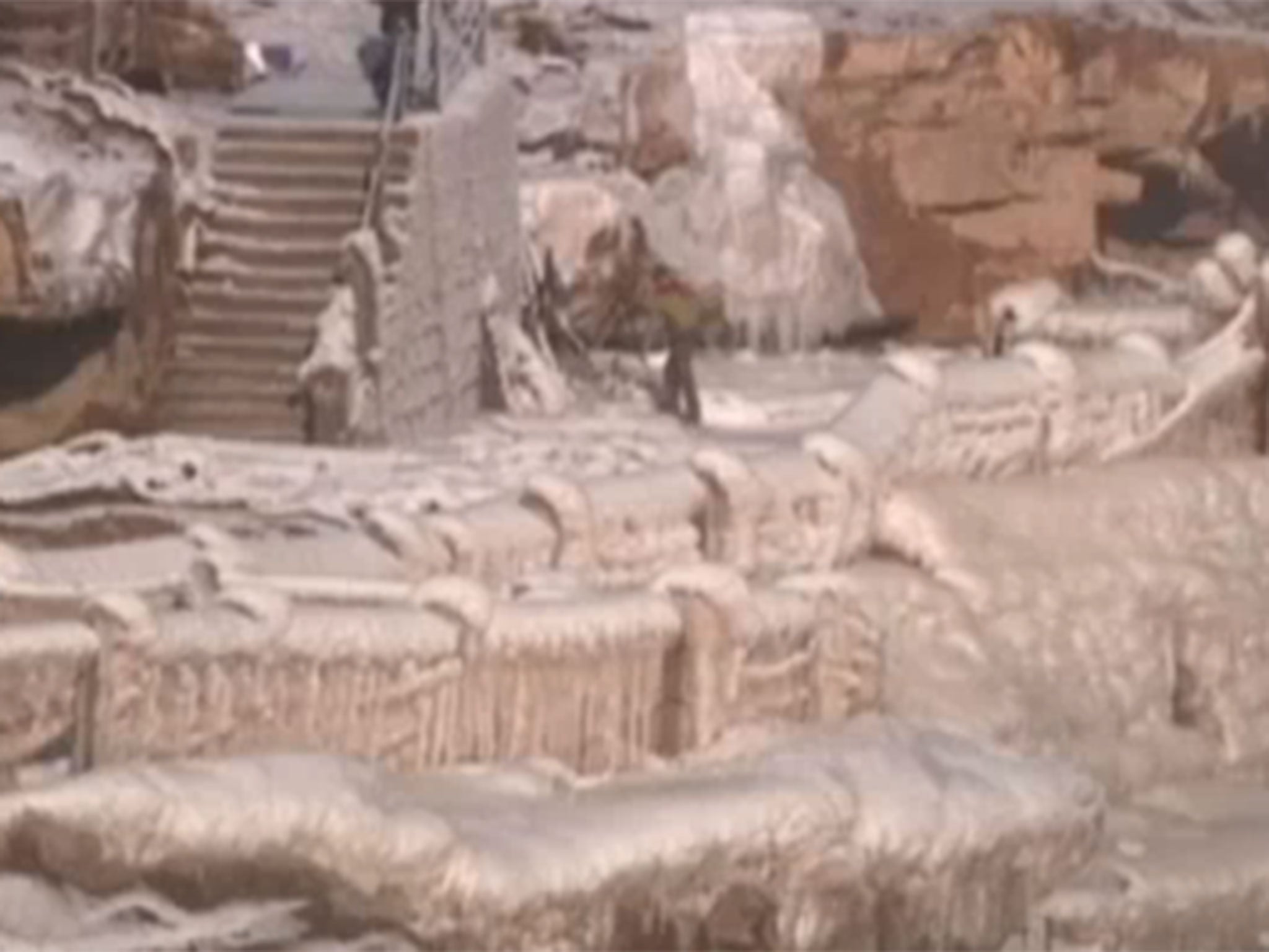 Tourists are flocking to a section of China's Yellow River in far greater numbers as part of the Hukou Waterfall has frozen over in the incredibly cold weather.