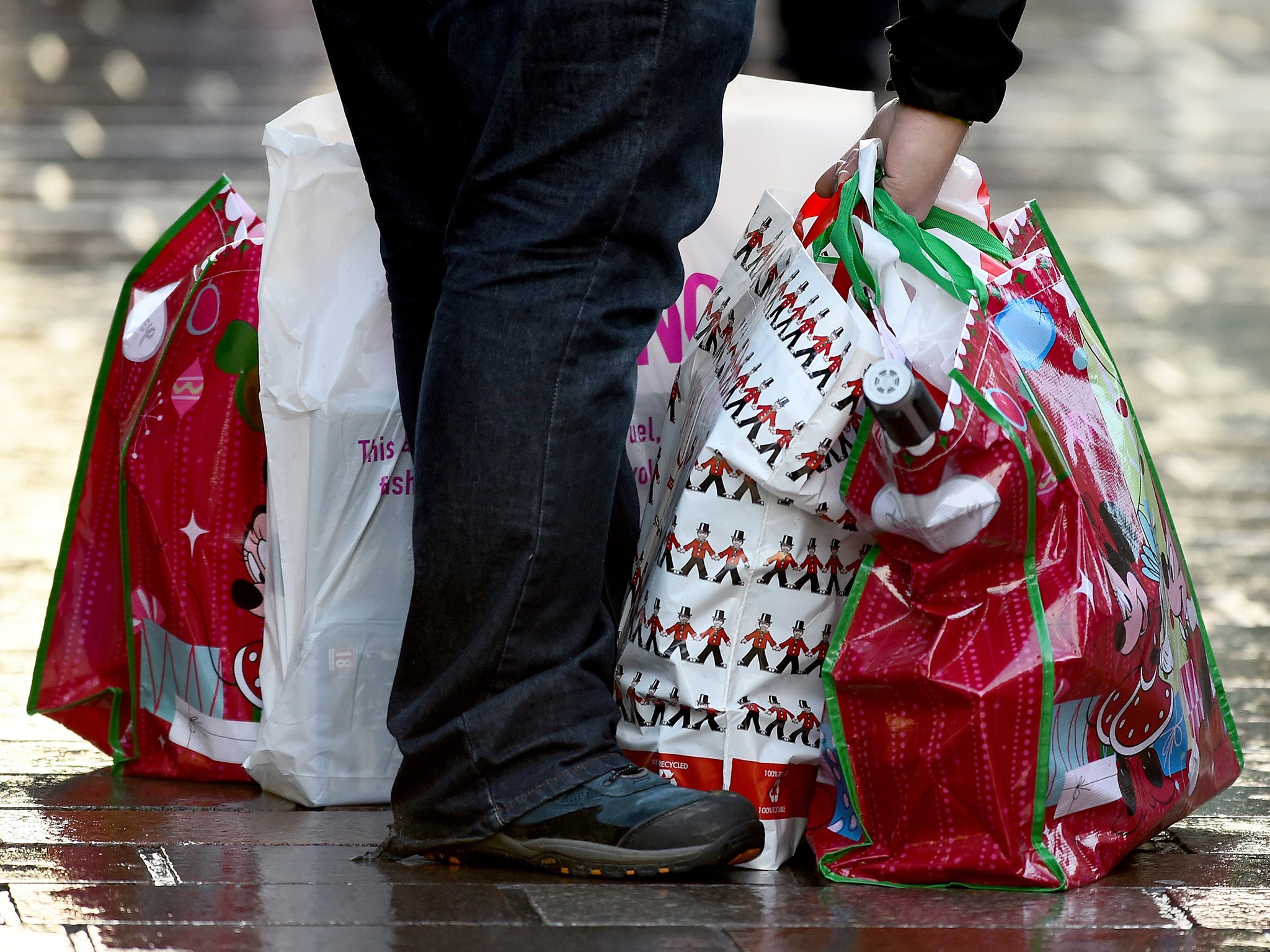 Shoppers look for Christmas gifts on the high street in Glasgow, Scotland.