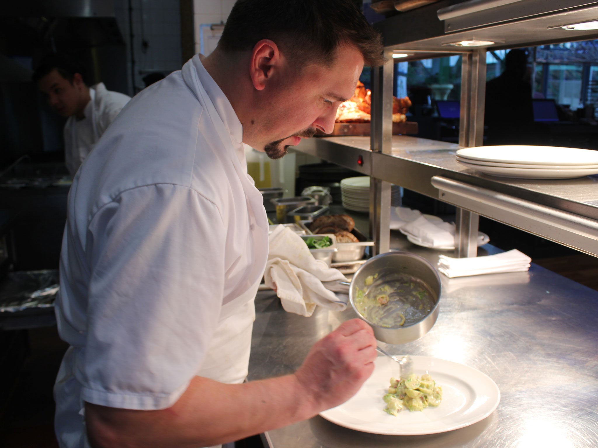 Marcus serves the Brussels sprouts (Image: Kashmira Gander)