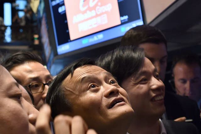 Alibaba founder Jack Ma – now the richest person in China –  waits for his company’s stock to go live on the floor at the New York Stock Exchange in September