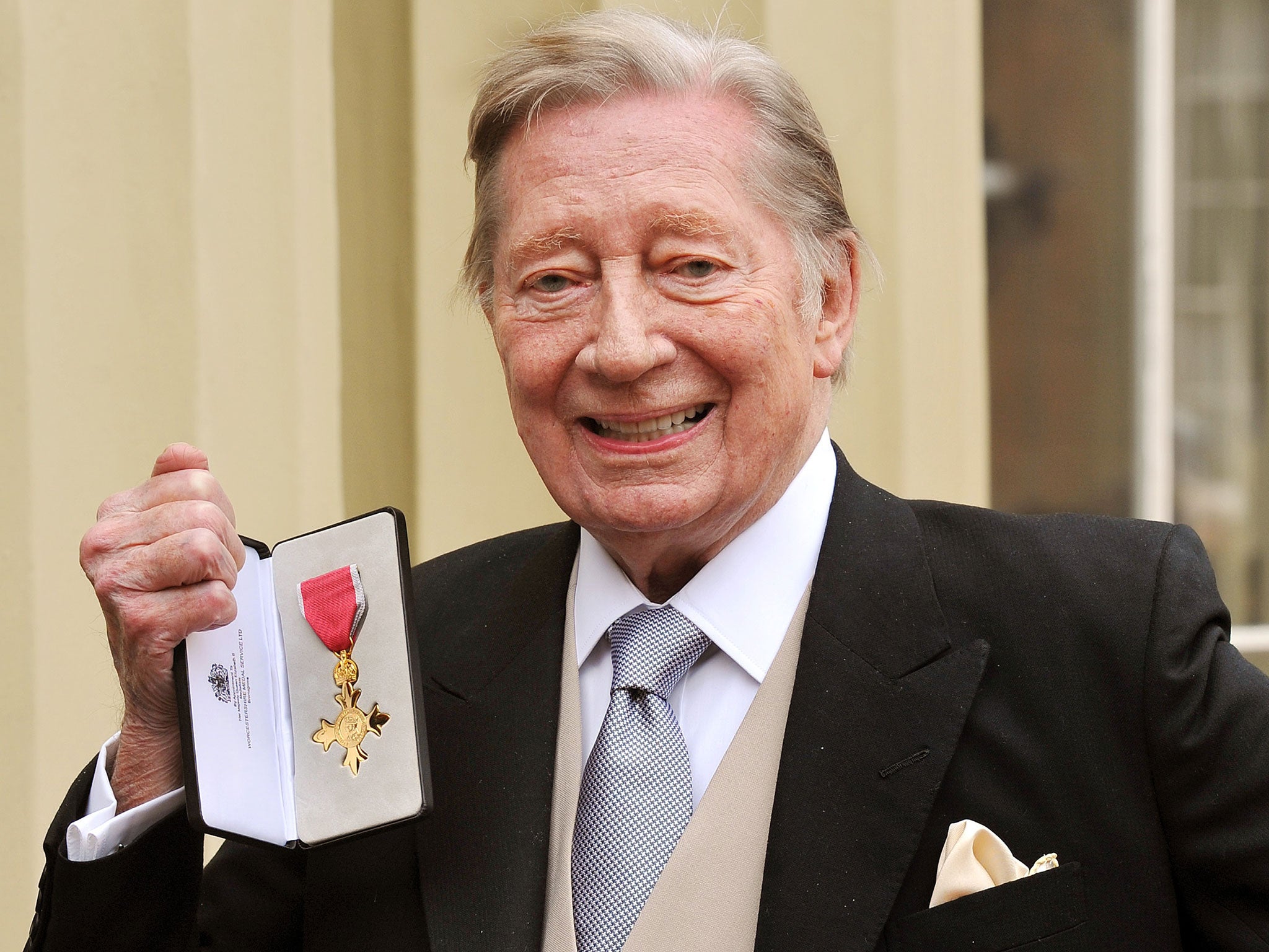 Lloyd in 2012 after receiving hs OBE for services to comedy