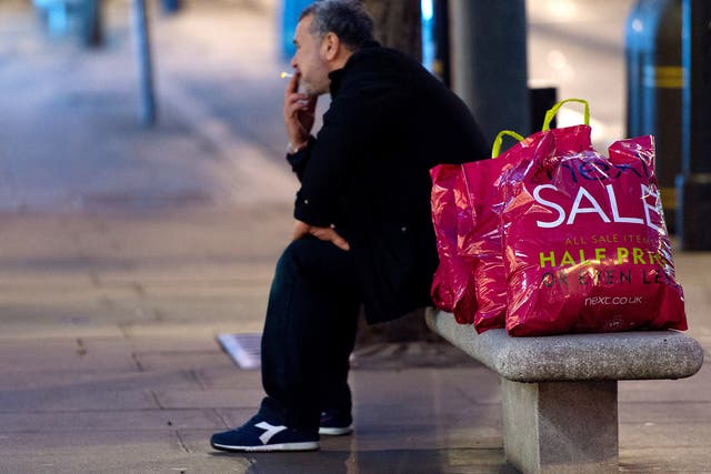 A man takes a break during the Boxing Day sales