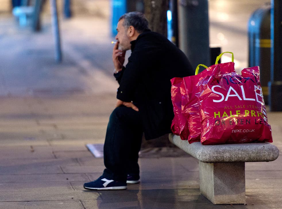 A man takes a break during the Boxing Day sales