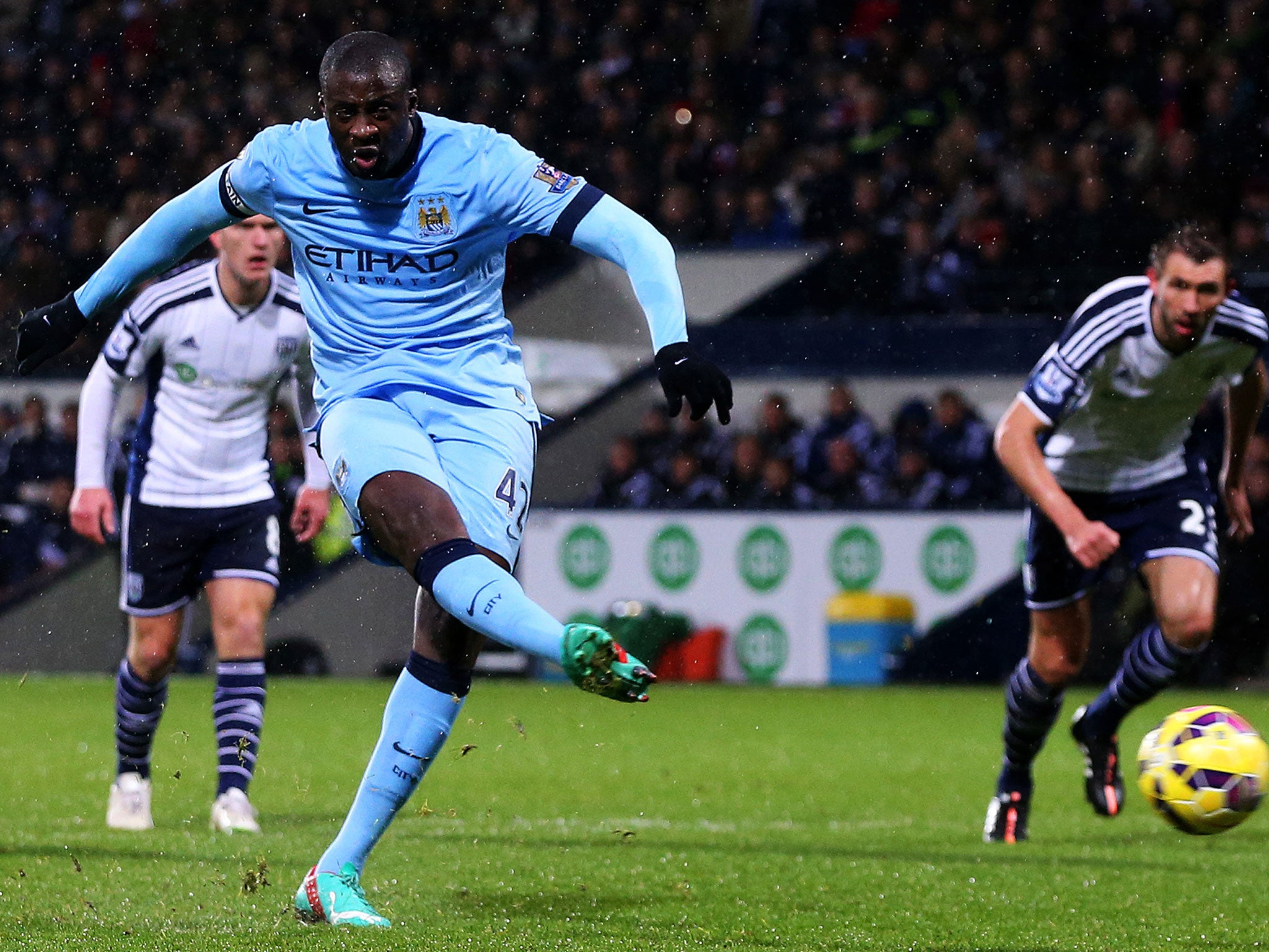 Yaya Toure converts a first-half penalty to double City's lead