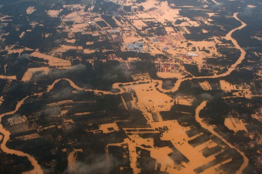 Aerial view of houses and plantations submerged in floodwaters in Pengkalan Chepa, near Kota Bharu