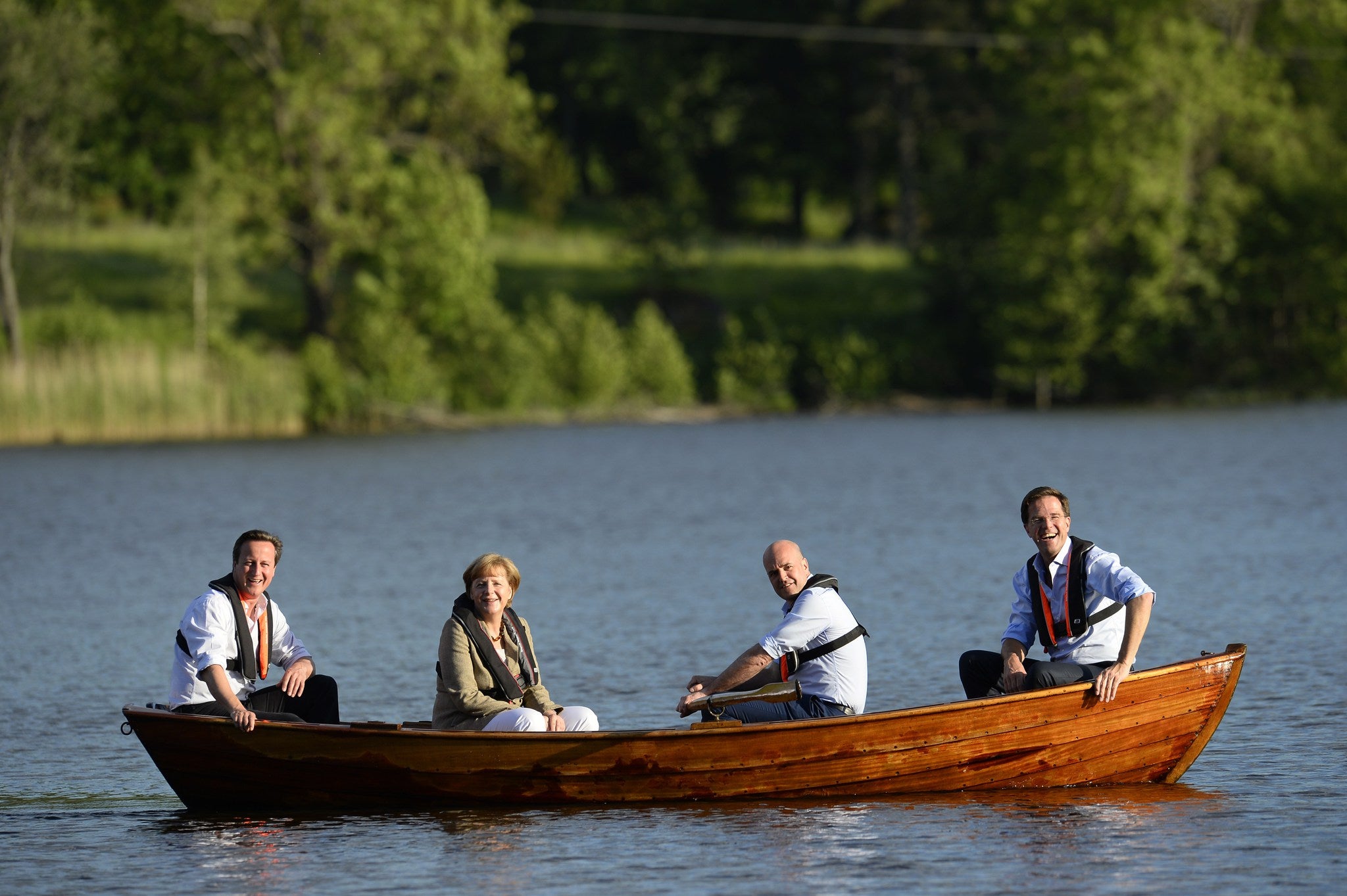 British Prime Minister David Cameron, German Chancellor Angela Merkel, Swedish Prime minister Fredrik Reinfeldt and Dutch Prime Minister Mark Rutte in a boat