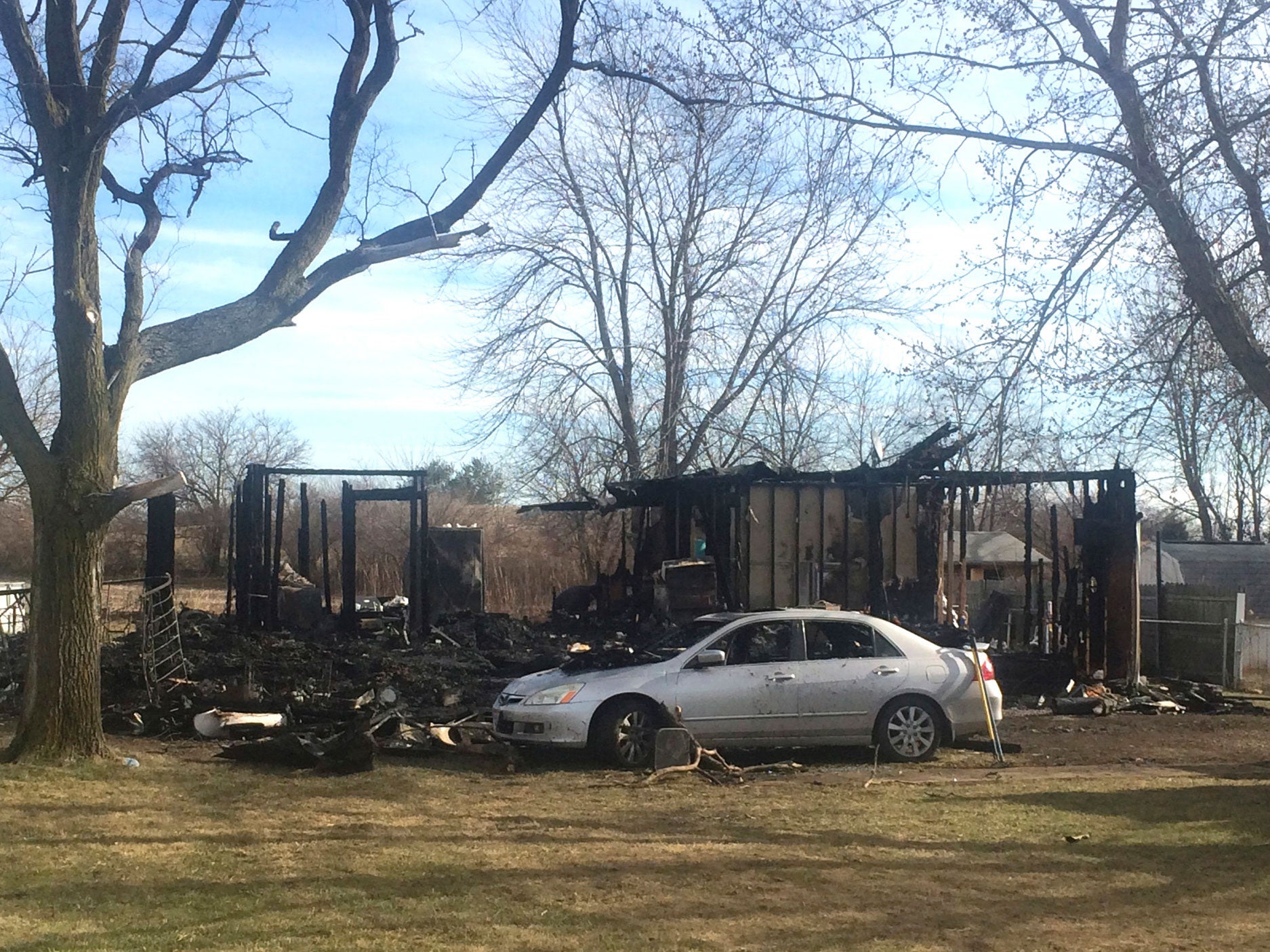 The scene of a house where a grandmother and her three grandchildren were killed in a fire in Fayette County, Ohio