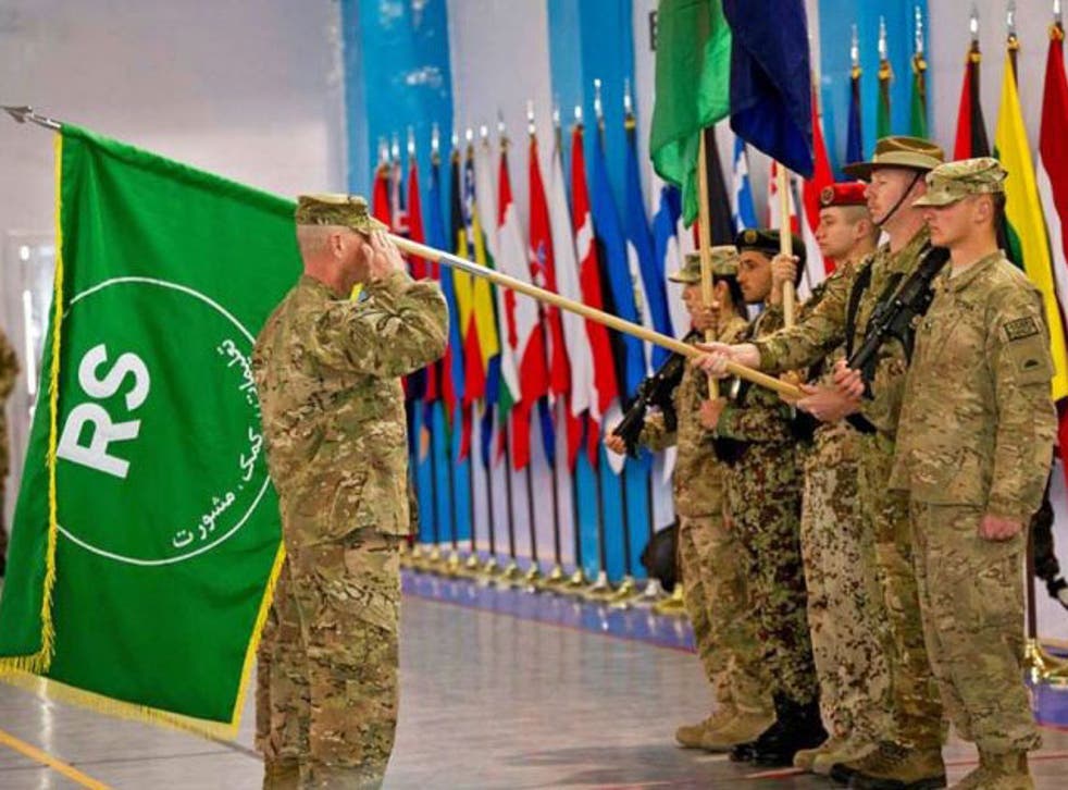 Command Sergeant Major, Delbert D. Byers, saluting during the Isaf presentation of Resolute Support at the Change of Mission Ceremony in Kabul, Afghanistan, 28 December 2014