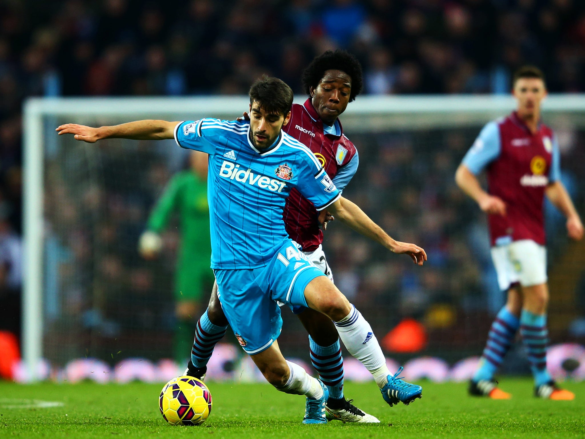 Carlos Sanchez of Aston Villa battles for the ball with Jordi Gomez