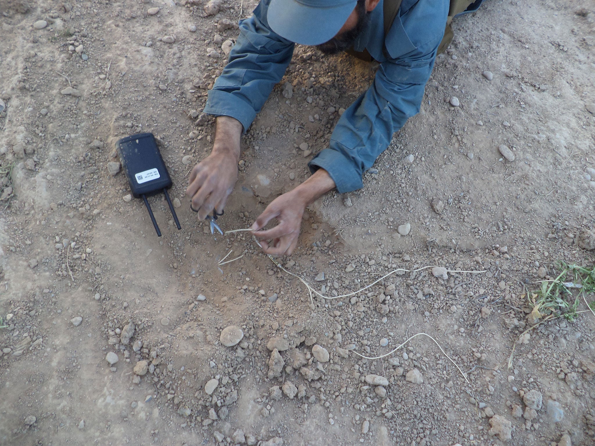 Abdul Afghanyar has little protection when disarming bombs