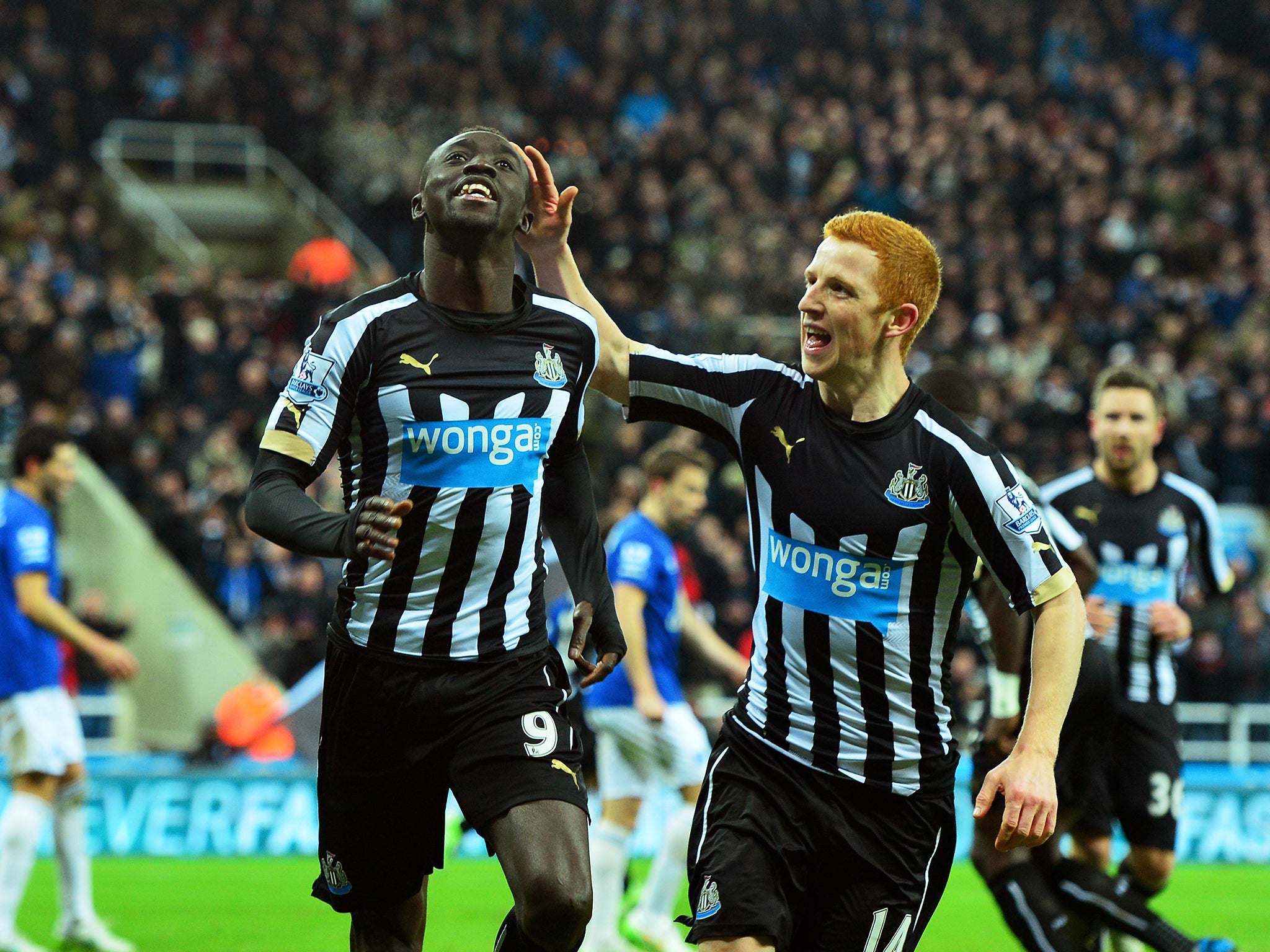 Papiss Demba Cisse of Newcastle United celebrates with team-mate Jack Colback after scoring against Everton