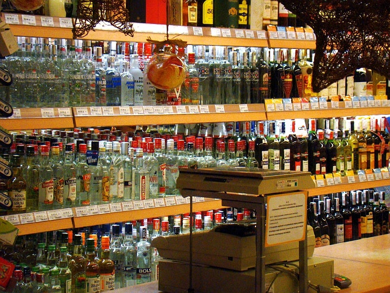A shop shelf with vodka and other spirits