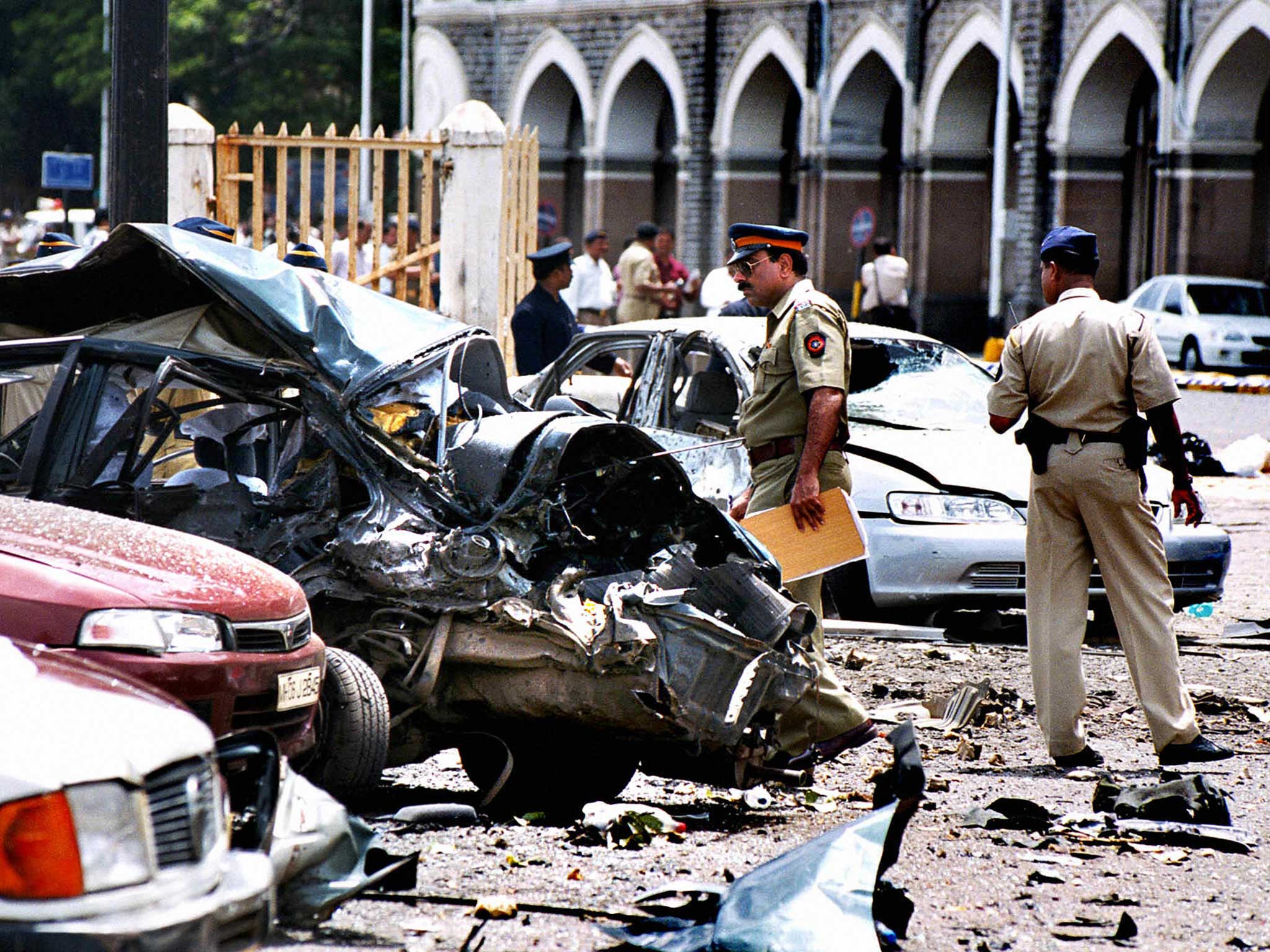 Police officers survey some of the damage in the aftermath of the 2008 Mumbai bombings