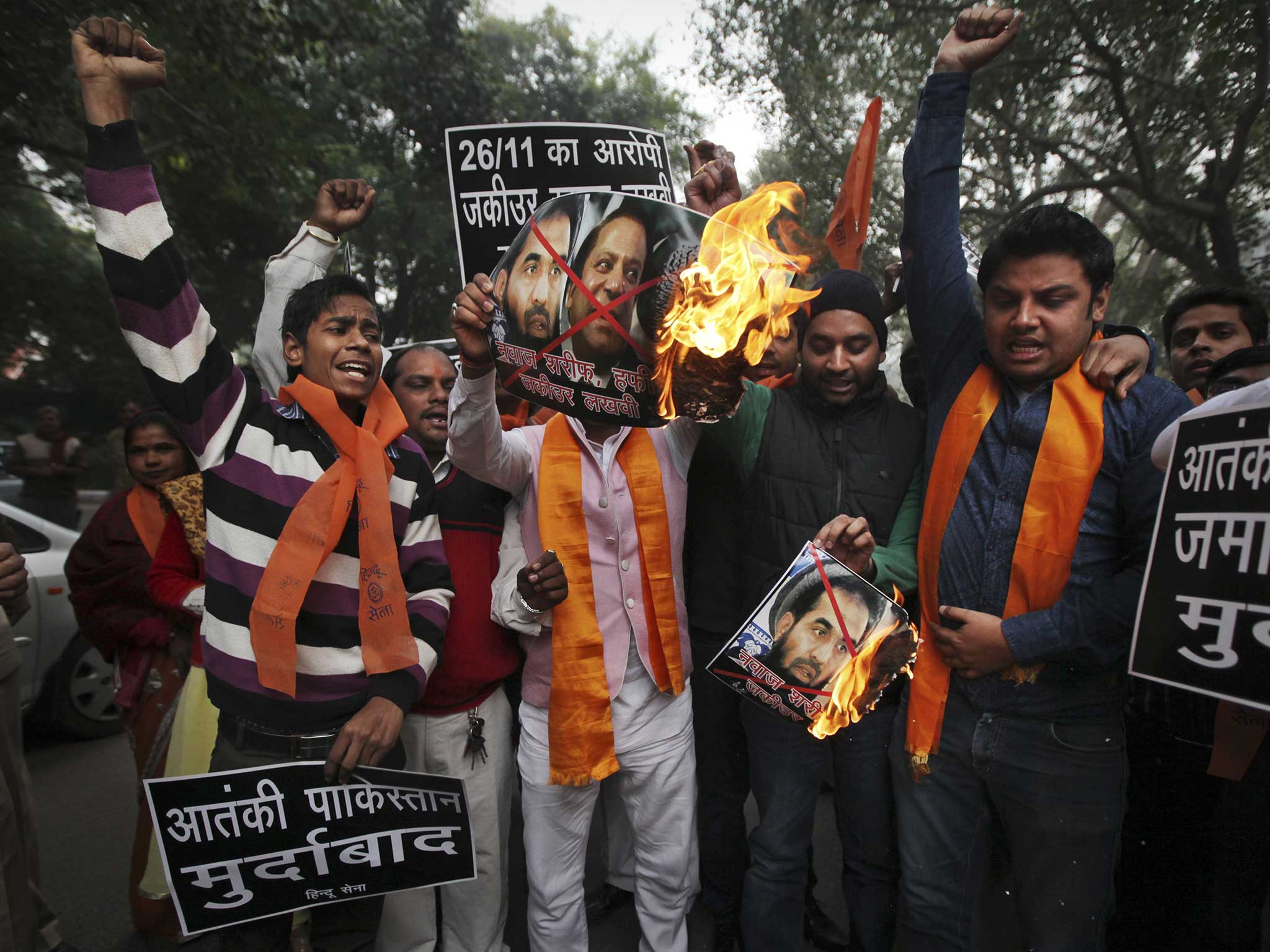 Protesters earlier this month demonstrate against Prime Minister Sharif, top right, and Zaki-ur-Rahman Lakhvi,after the former was granted bail