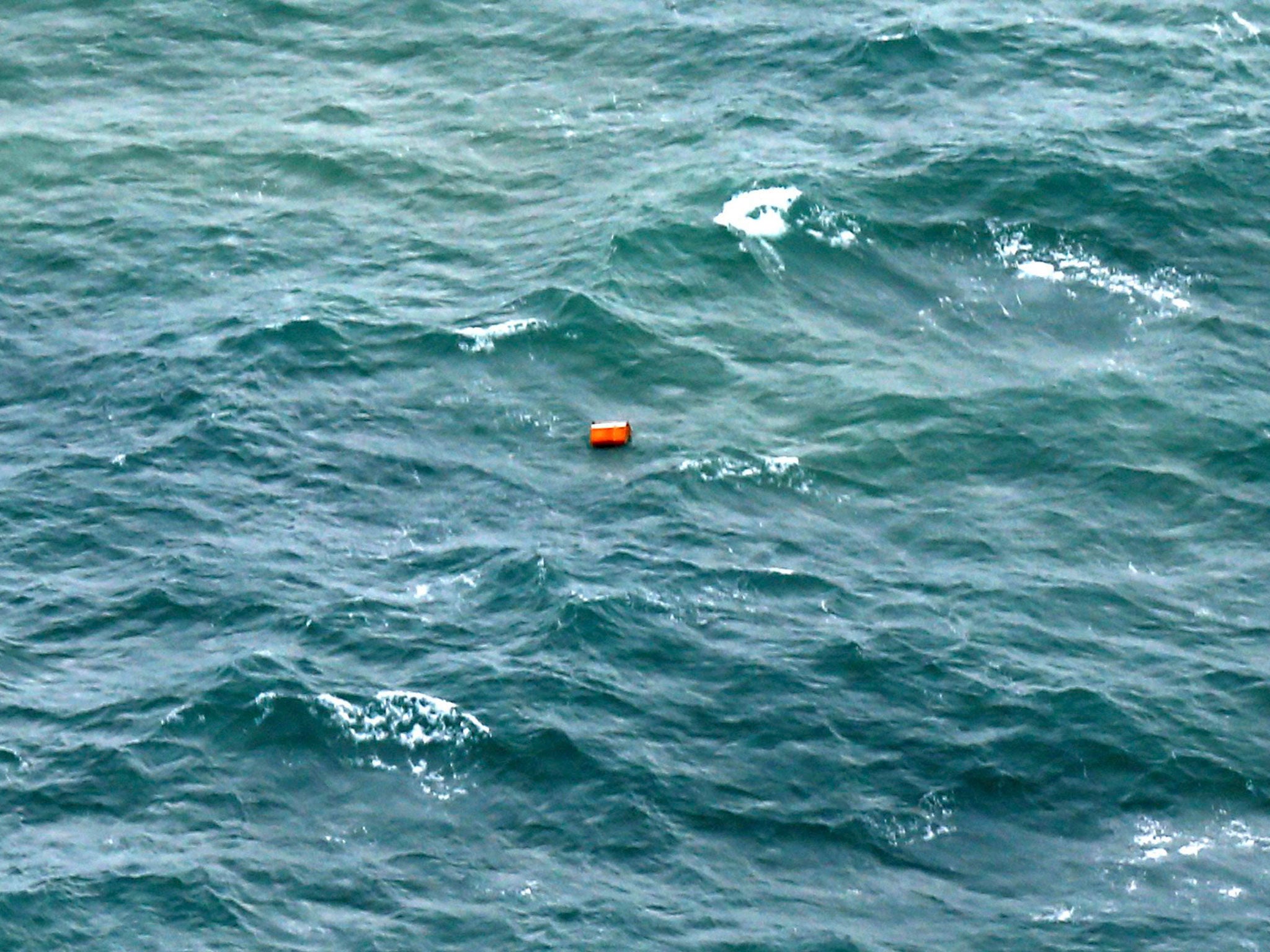 An unidentified object, found during a search and rescue operation by the Indonesian Air Force for the missing AirAsia plane, is seen floating in the ocean off the coast of Pangkalan Bun, Borneo, Indonesia