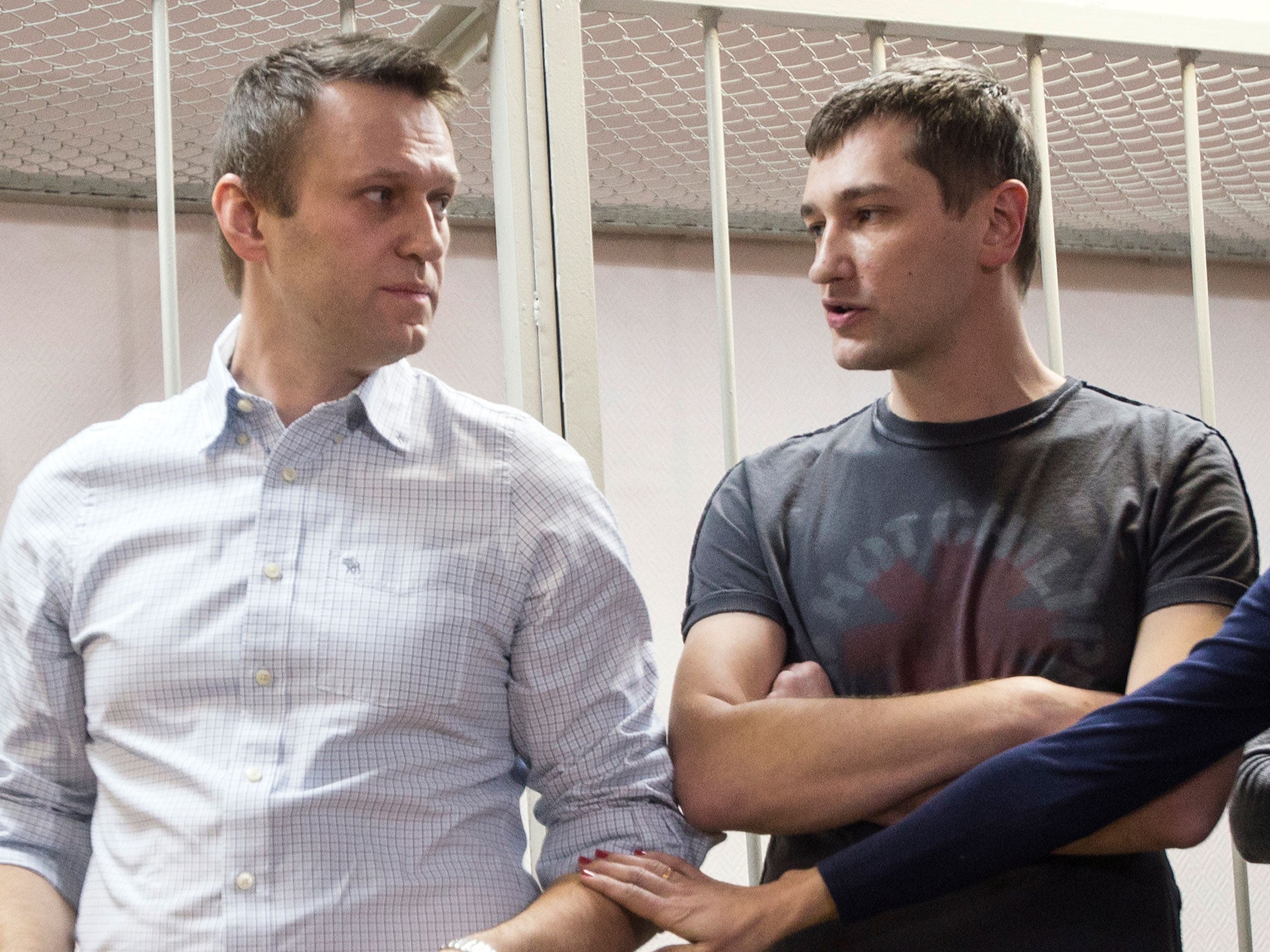 Russian opposition activist Alexei Navalny and his brother Oleg Navalny at a court in Moscow, Russia, Tuesday, Dec. 30, 2014
