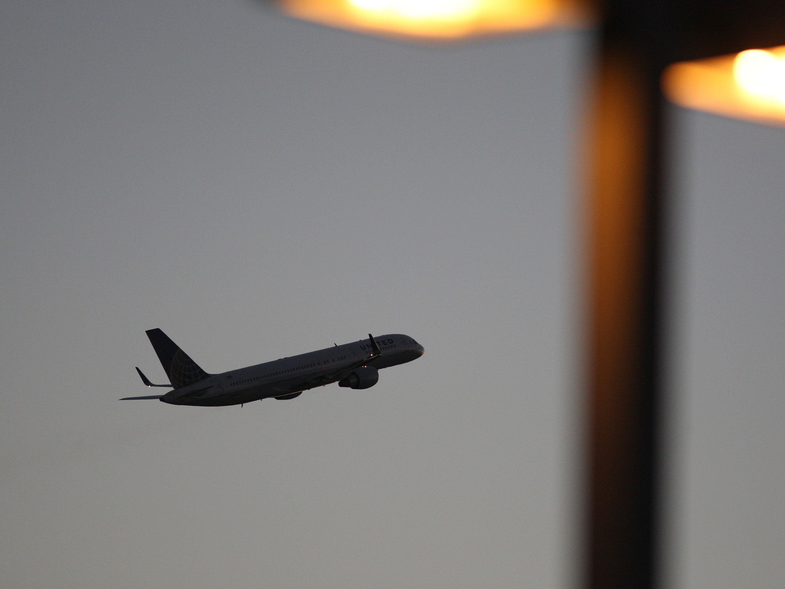 A United Airlines jet takes off at LAX