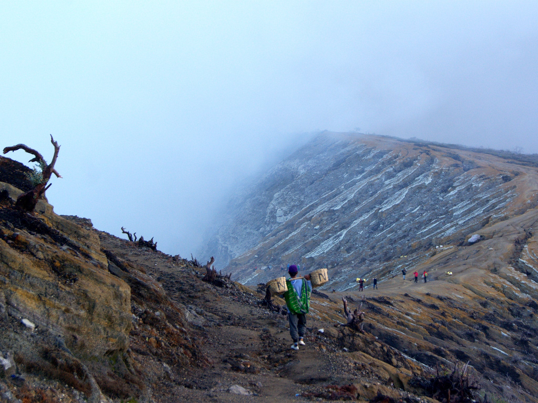 Dig deep: sulphur miners at the rim of the Ijen volcano