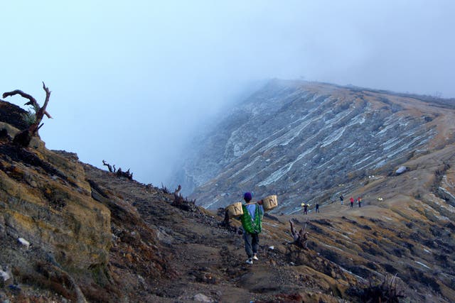 Dig deep: sulphur miners at the rim of the Ijen volcano