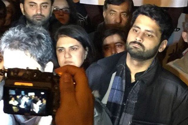 Jibran Nasir (right) protests at the Red Mosque in Islamabad