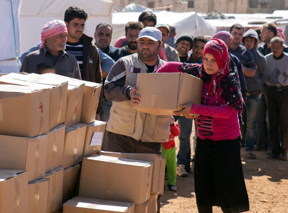 International charity aid arrives at a refugee camp for Syrians in Lebanon