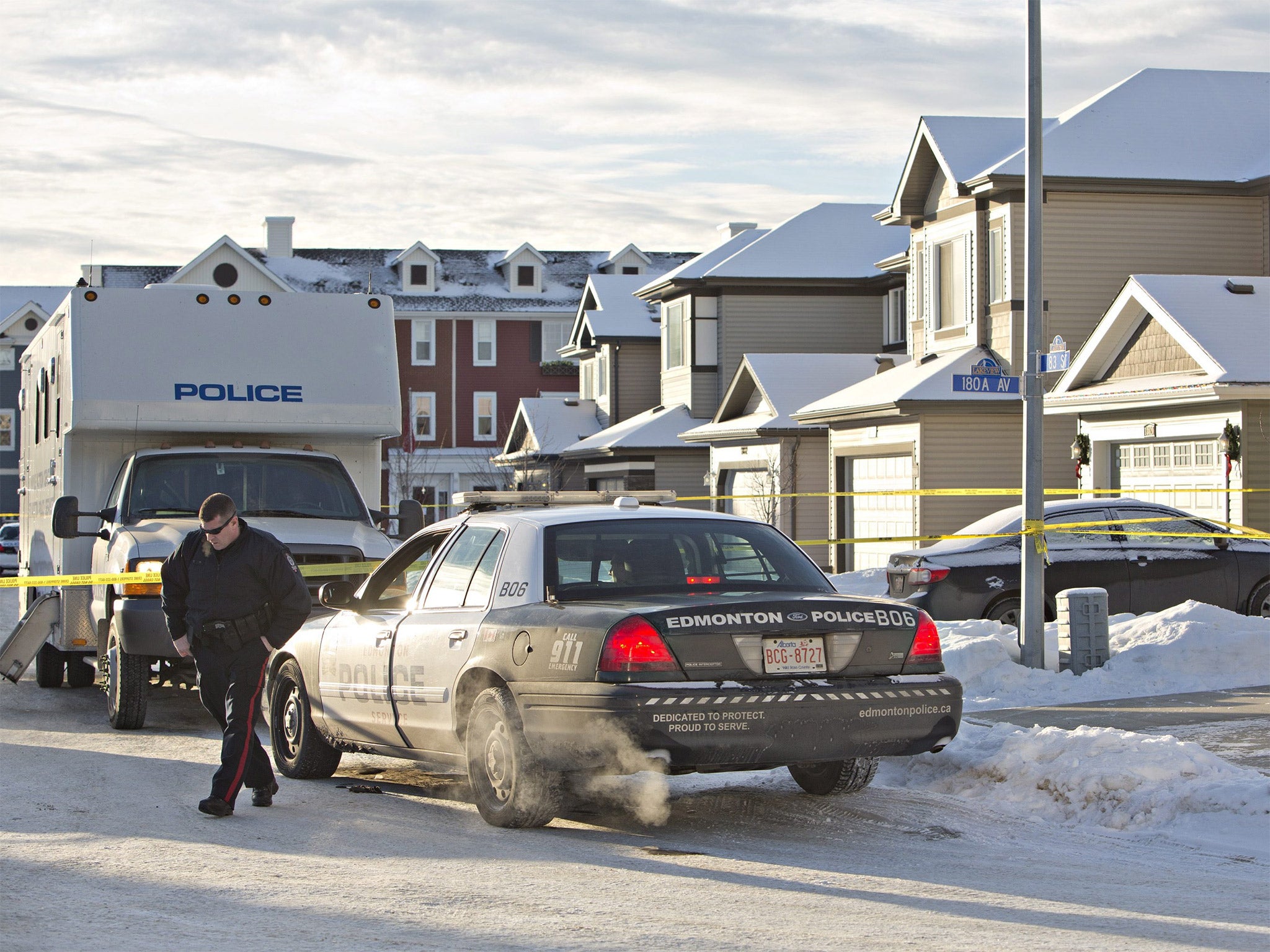 Police investigate the scene where multiple deaths occurred in Edmonton, Alberta, Canada
