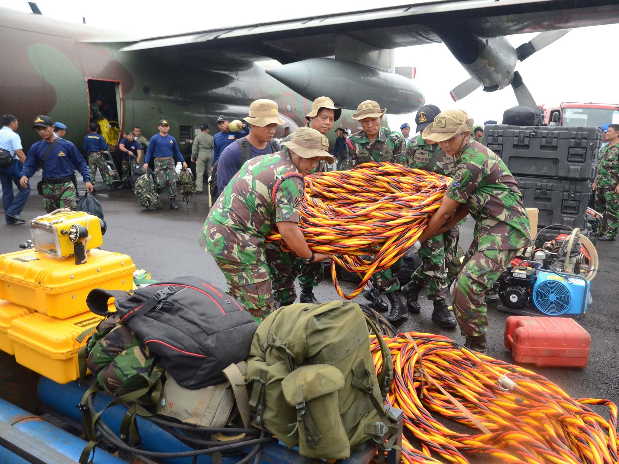 Members of the Indonesia marines unload their diving equipment