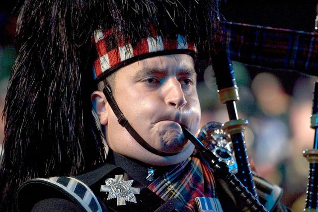 A bagpiper performs at the Edinburgh Military Tattoo