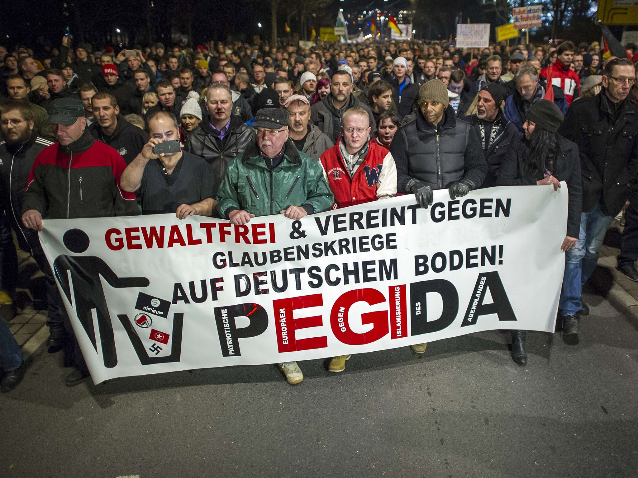 Supporters of the PEGIDA movement, 'Patriotische Europaeer gegen die Islamisierung des Abendlandes,' which translates to 'Patriotic Europeans Against the Islamification of the Occident'