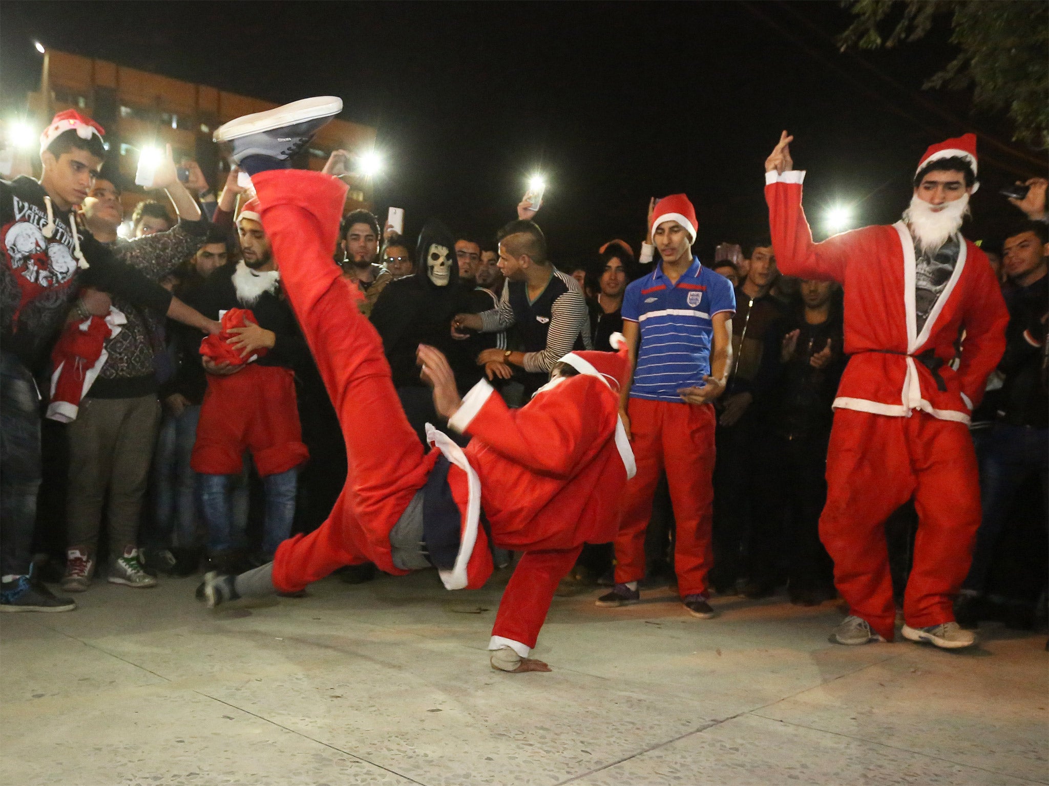 Performers dressed in Santa Claus celebrate in Baghdad, Iraq