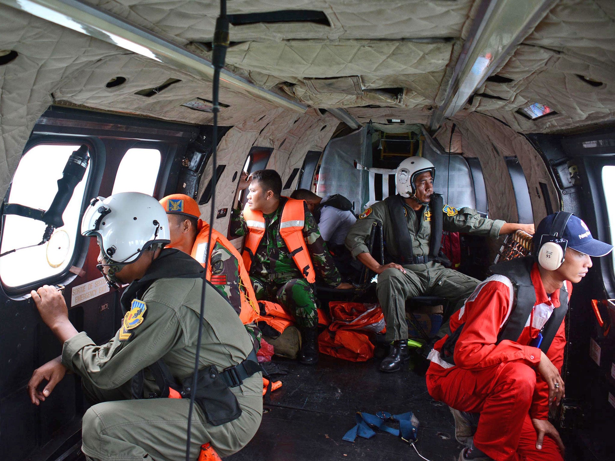 Indonesian Air Force personnel during a search operation for the victims of the crashed AirAsia plane over the Java Sea, 1 January 2015