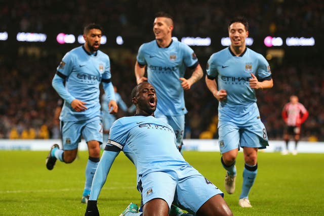  Yaya Toure of Manchester City celebrates the opening goal 