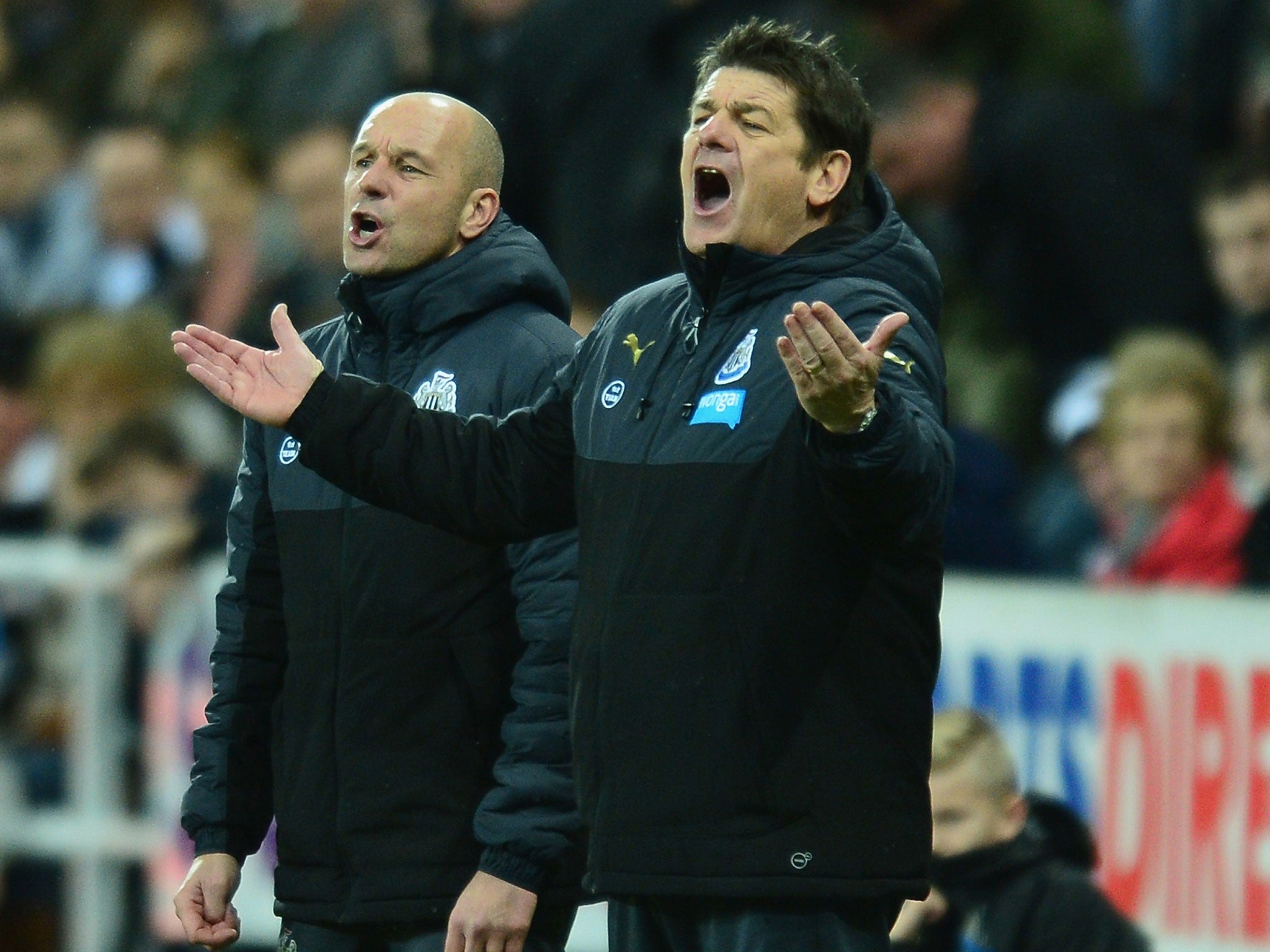 Newcastle caretaker manager John Carver (right) reacts
