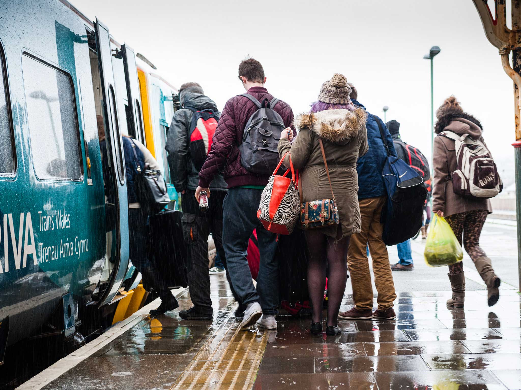 Travellers board a Arriva Trains Wales in 2011